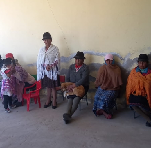 a group of people sitting on chairs